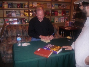 Kevin signing books for a fan