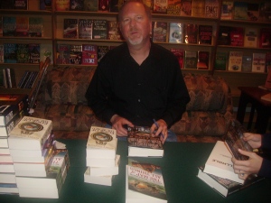 Kevin signs all the copies of his books in the store